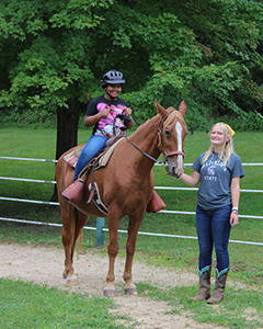 The Equestrian Instructor provides engaging and safe programming with horses to campers of all experience levels.