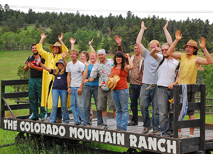 The summer staff at the Colorado Mountain Ranch showing off their spirit on the welcome wagon. 